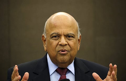 South African Finance Minister Pravin Gordhan gestures during a media briefing in Sandton near Johannesburg, March 14, 2016. Gordhan said on Monday he had constructive discussions with ratings agencies on a roadshow in London and the United States last week as Pretoria tries to fend off downgrades amid weak economic growth. REUTERS/Siphiwe Sibeko
