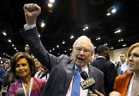 Berkshire Hathaway CEO Warren Buffett yells "Go big red!", the Nebraska Cornhuskers chant, prior to the Berkshire annual meeting in Omaha, Nebraska May 2, 2015. Buffett and Berkshire Hathaway Inc will this weekend welcome tens of thousands of people to Omaha for the company's annual shareholder gathering, which Buffett calls "Woodstock for Capitalists." REUTERS/Rick Wilking/File Photo