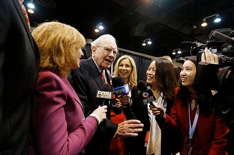 Warren Buffett talks to reporters as he tours the exhibit hall during the Berkshire Hathaway Annual Shareholders Meeting at the CenturyLink Center in Omaha, Nebraska, U.S. April 30, 2016. REUTERS/Ryan Henriksen