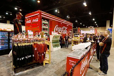 The Coca-Cola booth is set up in the exhibit hall of the Berkshire Hathaway Annual Shareholders Meeting at the CenturyLink Center in Omaha, Nebraska, U.S. April 30, 2016. REUTERS/Ryan Henriksen