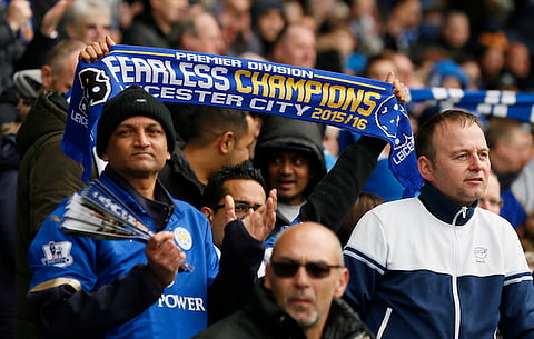 Football Soccer - Leicester City v Swansea City - Barclays Premier League - The King Power Stadium - 24/4/16 Leicester City fan holds up a scarf. Action Images via Reuters / Jason Cairnduff
Livepic