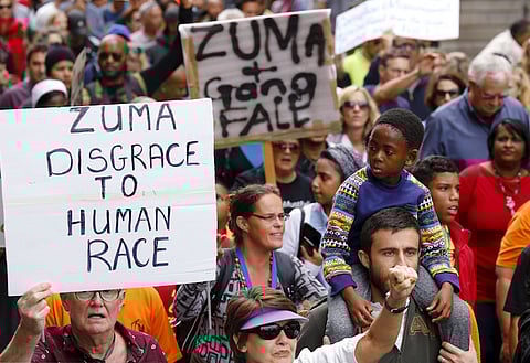 Protesters call for the removal of South Africa's President Jacob Zuma as the country commemorates the anniversary the country's first democratic elections in Cape Town, April 27, 2016. REUTERS/Mike Hutchings
