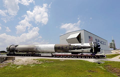The recovered first stage of a SpaceX Falcon 9 rocket is transported to the SpaceX hangar at launch pad 39A at the Kennedy Space Center in Cape Canaveral, Florida May 14, 2016. The vehicle was launched on May 6 and returned to land a short time later aboard a barge in the Atlantic Ocean. REUTERS/Joe Skipper