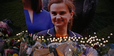 Tributes for Labour Party MP Jo Cox, who was shot dead in the street in northern England, are displayed on Parliament Square in London, Britain, June 16, 2016. REUTERS/Neil Hall