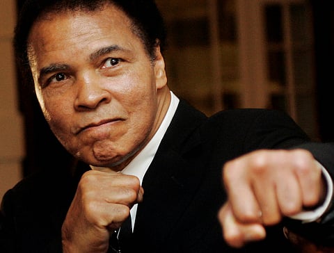 U.S. boxing great Muhammad Ali poses during the Crystal Award ceremony at the World Economic Forum (WEF) in Davos, Switzerland, in this January 28, 2006 file photo. REUTERS/Andreas Meier/File Photo