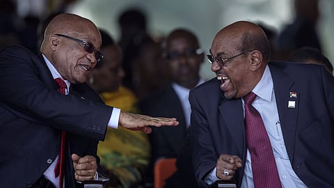 Sudan's President Omar Hassan al-Bashir (R) laughs while having a conversation with his South African countarpart Jacob Zuma at the swearing-in ceremony of Uganda's president, Yoweri Kaguta Museveni at the Kololo independence grounds in Kampala, Uganda, May 12, 2016. REUTERS/Edward Echwalu