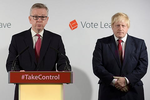 Britain's Justice Secretary Michael Gove (L) speaks as Vote Leave campaign leader Boris Johnson listens at the group's headquarters in London, Britain June 24, 2016. REUTERS/Stefan Rousseau/Pool/File Photo TPX IMAGES OF THE DAY