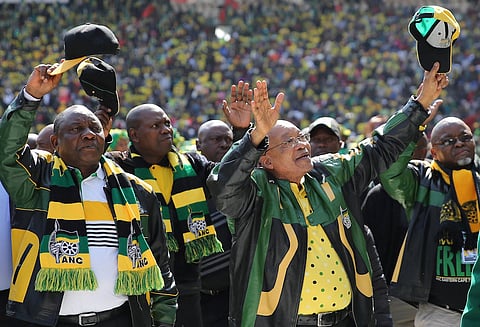 African National Congress (ANC) president, Jacob Zuma (2nd R) waves to his supporters. REUTERS/Siphiwe Sibeko