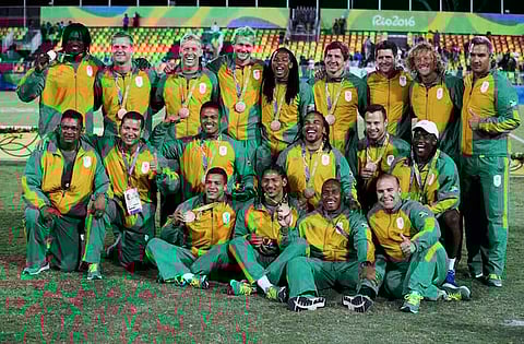 2016 Rio Olympics - Rugby - Men's Victory Ceremony - Deodoro Stadium - Rio de Janeiro, Brazil - 11/08/2016. Team South Africa pose for photos with their bronze medals. REUTERS/Phil Noble