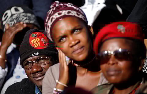 Supporters of South Africa's Economic Freedom Fighters (EFF) listen to their leader Julius Malema. REUTERS/Siphiwe Sibeko.