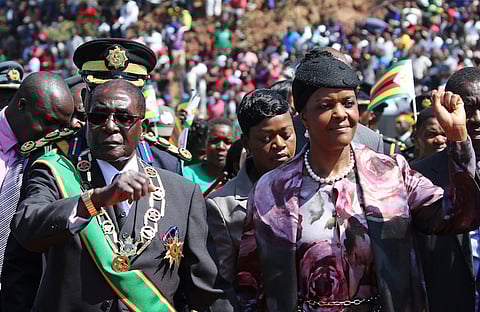 Zimbabwe's President Robert Mugabe and his wife Grace arrive to address a gathering to mark the National Heroes Day celebrations in the capital Harare, Zimbabwe August 8, 2016. REUTERS/Philimon Bulawayo