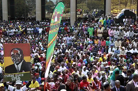 Thousands of supporters of the ruling party Zanu PF gather outside the party headquarters to show support for President Robert Mugabe following a wave of anti-governement protests over the last two weeks in Harare, Zimbabwe July 20, 2016. REUTERS/Philimon Bulawayo