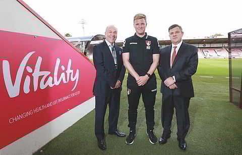 AFC Bounemouth's chairman Jeff Mostyn (left) with the club's brilliant young manager Eddie Howe and Neville Koopowitz, CEO of the stadium's title sponsor Vitality.