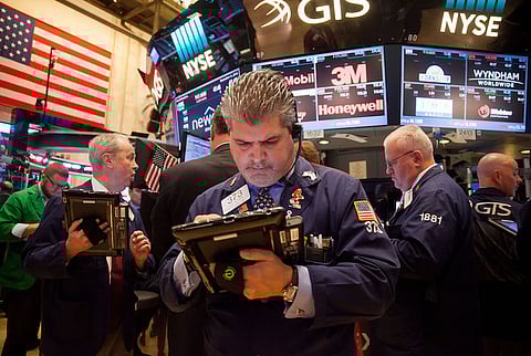 Traders work on the floor of the New York Stock Exchange (NYSE) in New York, U.S. Photographer: Michael Nagle/Bloomberg