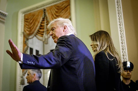 U.S. President-elect Donald Trump, left, and First Lady-elect Melania Trump. Photographer: Pete Marovich/Bloomberg