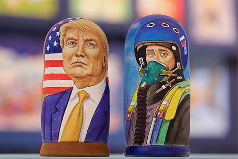 A martyoshka doll showing Donald Trump, U.S. president elect, left, sits beside a doll showing Vladimir Putin, Russia's president, dressed as a military pilot, in a souvenir store in Moscow, Russia, Nov. 9, 2016. The ruble dropped as Donald Trump won the U.S. presidential race, driving down crude prices on concern his protectionist policies will sap global growth. Photographer: Andrey Rudakov/Bloomberg