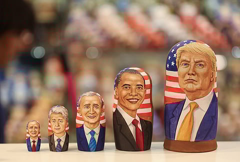 A martyoshka doll showing Donald Trump, U.S. President-elect, right, sits beside dolls representing former U.S. presidents, including Barack Obama, second right, William "Bill" Clinton, and George W. Bush, third right. Photographer: Andrey Rudakov/Bloomberg