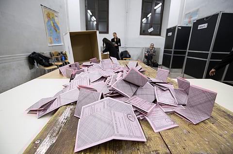 Members of the electoral commission prepare ballot slips for the count after polls closed during the constitutional reform referendum results in Rome, Italy, on Sunday, Dec. 4, 2016. Prime Minister Matteo Renzi looked set to lose the constitutional referendum he's staked his job on, as exit polls showed Italians joining the global backlash against establishment politics. Photographer: Alessia Pierdomenico/Bloomberg