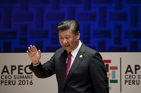 Xi Jinping, China's president, waves while walking on stage during the Asia-Pacific Economic Cooperation (APEC) 2016 CEO Summit in Lima, Peru, on Saturday, Nov. 19, 2016. APEC aims to create greater prosperity for the people of the Asia-Pacific by promoting balanced, inclusive, sustainable, innovative and secure growth and by accelerating regional economic integration. Photographer: Guillermo Gutierrez/Bloomberg