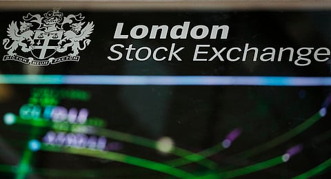 A London Stock Exchange sign sits on glass in the atrium of the London Stock Exchange Group Plc's offices in London, U.K., on Friday, Oct. 14, 2016. The FTSE 100 Index climbed 0.6 percent at 8:44 a.m. in London, after posting its biggest three-day slide in a month. Photographer: Luke MacGregor/Bloomberg