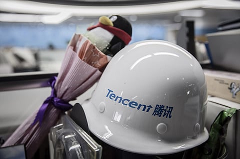 A construction helmet sits on a desk at Tencent Holdings Ltd.'s headquarters in Shenzhen, China, on Monday, Aug. 22, 2016. The new headquarters for Tencent is a $599 million project aimed at creating a campus-like atmosphere for the urban setting. Scheduled for completion next year, the Shenzhen skyscraper could become one of the largest labs for new internet services and connected devices. Photographer: Qilai Shen/Bloomberg