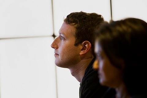 Mark Zuckerberg, chief executive officer and founder of Facebook Inc., and Sheryl Sandberg, chief operating officer of Facebook Inc., watch a presentation during an event at Facebook Inc. headquarters in Menlo Park, California, U.S., on Thursday, June 20, 2013. Facebook Inc., operator of the largest social network, plans to unveil video-sharing tools, bringing its Instagram into closer competition with Twitter Inc., a person with knowledge of the matter said. Photographer: David Paul Morris/Bloomberg*** Local Caption *** Mark Zuckerberg;Sheryl Sandberg