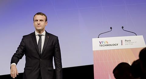 Emmanuel Macron, France's president, stands on stage at the Viva Technology conference in Paris, France, on Thursday, June 15, 2017. Outgoing chief executive officer of Publicis Group SA Maurice Levy expects hundreds of millions of euros of investments to be made linked to this week's VivaTechnology conference, up from at least 100 million euros raised during and following the first edition a year ago. Photographer: Marlene Awaad/Bloomberg
