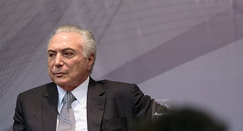 Michel Temer, Brazil's president, listens during an event in Sao Paulo, Brazil, on Monday, Aug. 7, 2017. Temer and ministers announced that the federal government was handing over an area of Campo de Marte airport in Sao Paulo to the city hall for the construction of a park. Photographer: Patricia Monteiro/Bloomberg