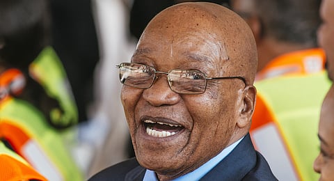 Jacob Zuma, South Africa's president, reacts as he attends the launch of a new trans Africa locomotive at the Transnet SOC Ltd. engineering site in Pretoria, South Africa, on Tuesday, April 4, 2017. Zuma’s shock decision to fire his finance minister and stack his cabinet with loyalists may have seemed like good politics, but it’s led to an immediate downgrade of the nation’s credit rating by S&P Global Ratings that will cost an already moribund economy dearly. Photographer: Waldo Swiegers/Bloomberg