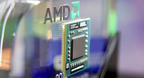 An Advanced Micro Devices Inc. AMD-A10-4600M Series APU computer chip is displayed at the AMD booth at Computex Taipei 2012 in Taipei, Taiwan, on Tuesday, June 5, 2012.  Photographer: Ashley Pon/Bloomberg