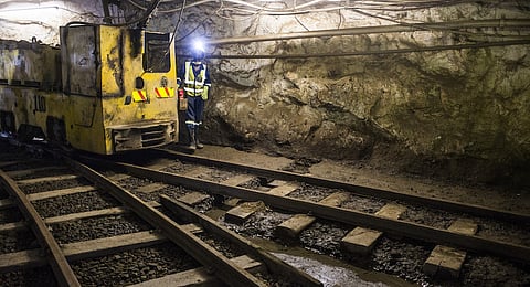 Mining wagons sit on rail tracks in an underground tunnel at the 296 meter level at the Nchanga copper mine, operated by Konkola Copper Mines Plc, in Chingola, Zambia, on Thursday, March 17, 2016. Photographer: Waldo Swiegers/Bloomberg