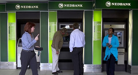 Customers use the Nedbank Group Ltd. automatic teller machines (ATM) near the company headquarters in Johannesburg, South Africa. Photographer: Nadine Hutton/Bloomberg