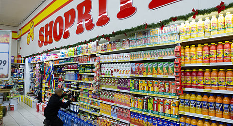 An employee restocks shelves with food products inside a Shoprite Holdings Ltd. store in Cape Town, South Africa, on Wednesday, Dec. 21, 2016. South Africa was a bright spot for banks on the continent in 2016, with stocks shrugging off the nation's economic woes to head for the third-best performance in the past decade. Photographer: Dean Hutton/Bloomberg