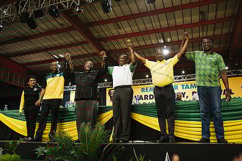 Cyril Ramaphosa, South Africa's deputy president and newly elected president of the African National Congress party (ANC), center, gestures on stage during the 54th national conference of the African National Congress party in Johannesburg, South Africa, on Monday, Dec. 18, 2017. With his election as leader of the ruling African National Congress on Monday, Ramaphosa, 65, will be the party's presidential candidate in 2019 and may take over running the country from Jacob Zuma sooner than that if he's ousted before the end of his second term. Photographer: Waldo Swiegers/Bloomberg