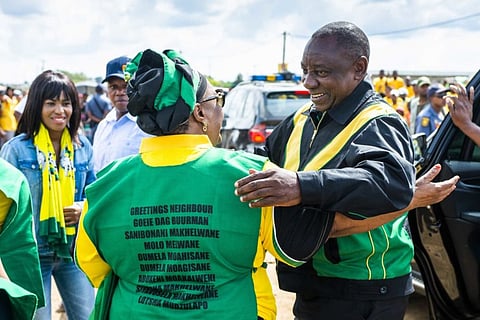 Cyril Ramaphosa embraces an ANC supporter during a campaign event in Bloemfontein, on April 7. Photographer: Waldo Swiegers/Bloomberg