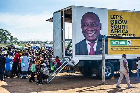 The face of Cyril Ramaphosa, South Africa's president, is displayed on the side of a campaign truck during an ANC campaign event in Bloemfontein on April 7. Photographer: Waldo Swiegers/Bloomberg