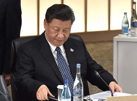Xi Jinping, China's president, attends a session at the Group of 20 (G-20) summit in Osaka, Japan, on Saturday, June 29, 2019. Disputes over wording on climate change and trade are unresolved shortly before Group of 20 leaders are due to release a communique from their summit in Japan, raising the risk of a very watered-down document or no statement at all. Photographer: Kazuhiro Nogi/Pool via Bloomberg