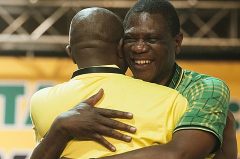 David Mabuza, newly appointed deputy president of the African National Congress party (ANC), right, embraces Paul Mashatile, newly elected treasurer general of the African National Congress party (ANC), during the 54th national conference of the African National Congress party in Johannesburg, South Africa, on Monday, Dec. 18, 2017. With his election as leader of the ruling African National Congress on Monday, Ramaphosa, 65, will be the party's presidential candidate in 2019 and may take over running the country from Jacob Zuma sooner than that if he's ousted before the end of his second term. Photographer: Waldo Swiegers/Bloomberg
