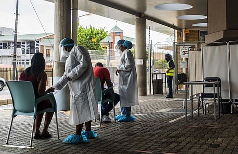 Health workers register patients at a Covid-19 testing station in the Richmond suburb of Johannesburg, on Feb. 10, 2021. Photographer: Waldo Swiegers/Bloomberg