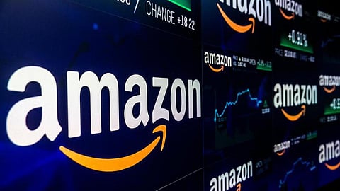 A monitor displays Amazon.com Inc. stock information at the Nasdaq MarketSite in New York, U.S., on Tuesday, Sep. 4, 2018. Amazon.com Inc. briefly became America's second trillion-dollar company on Tuesday after adding $434 billion to its market cap this year. Photographer: Jeenah Moon/Bloomberg