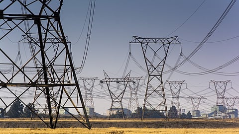 Electrical power lines hang from transmission pylons near to the Eskom Holdings SOC Ltd. Lethabo coal-fired power station in Vereeniging, South Africa, on Wednesday, Aug. 7, 2019. Eskom, South Africa’s biggest polluter, said emissions of particulate matter that cause chronic respiratory disease are at their highest level in two decades as the state power utility’s financial meltdown has seen it skip maintenance and has triggered strikes.