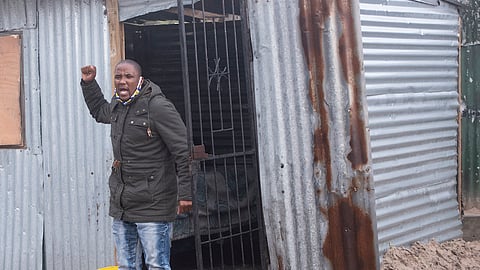 Bulelani Qholani speaks outside his shack on July 02, 2020 in Cape Town, South Africa. It is reported that the victim Bulelani Qholani was dragged naked out of his shack during evictions by four law enforcement officers. (Photo by Gallo Images/Brenton Geach)