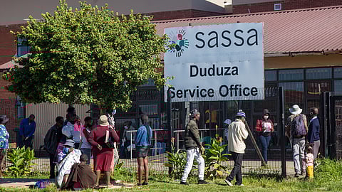 Social grant beneficiaries wait in long queues at the Sassa Office during adjusted lockdown level 3 on January 21, 2021 in Duduza, South Africa. It is reported that Sassa offices have been swamped by thousands of people needing to reapply for temporary disability grants which lapsed in December. (Photo by Gallo Images/OJ Koloti)