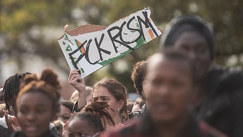 Students march against racism at Stellenbosch University on May 19, 2022 in Stellenbosch, South Africa. The march follows an alleged racist incident that saw a white student urinating on the personal property of a black student. (Photo by Gallo Images/Brenton Geach)