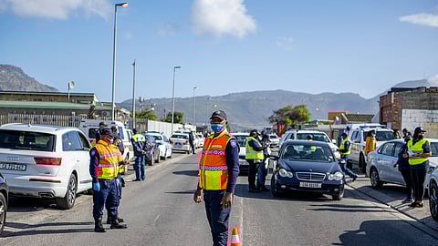 LEAP officers hold a road block in Military Road between Lavender and Seawinds on May 13, 2022 in Cape Town, South Africa. This is part of the launch of the LEAP Response Cape Town Metro Police Unit for Lavender Hill launched to help combat gang violence in the community. (Photo by Gallo Images/Die Burger/Jaco Marais)