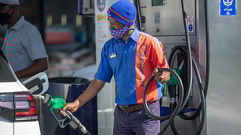 CAPE TOWN, SOUTH AFRICA - AUGUST 03: A petrol attendant filling up a car at a Engen service station on August 03, 2021 in Cape Town, South Africa. It is reported that the Energy Department announced that the petrol price will go up by 91 cents per litre for both grades and diesel will increase by between 54 and 55 cents per litre in August. (Photo by Gallo Images/Misha Jordaan)