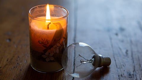 A candle and lightbulb to illustrate loadshedding on April 19, 2022 in Cape Town, South Africa. Eskom announced it would be implementing Stage 4 load shedding on Tuesday morning, while the City of Cape Town customers would go to Stage 3. (Photo by Gallo Images/Misha Jordaan)