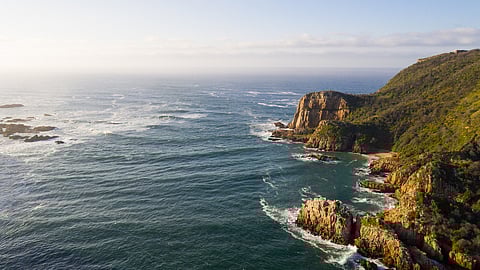 View over the famous Knysna Heads in South Africa. Ocean inlet into a large Estuary. Horizon over water