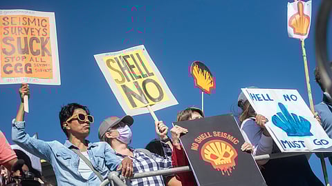 Protestors at the Waterfront waiting the arrival of  the Amazon Warrior . They are against the planned Shell seismic survey for oil and gas in the ocean on November 21, 2021 in Cape Town, South Africa.  It is reported that Shell has announced that it will carry out a three-dimensional seismic survey in search of oil and gas deposits from Morgan Bay to Port St Johns off the Wild Coast. (Photo by Gallo Images/Brenton Geach)