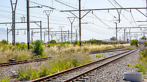 A general view of railway workers doing repairs on damaged railway infrastructure outside of Bellville station on October 22, 2020 in Bellville, South Africa. A lot of commuters rely on the rail service for transportation. (Photo by Gallo Images/Jacques Stander)